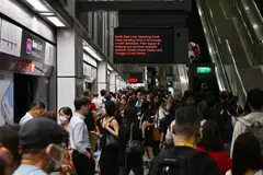 Commuters at the Dhoby Ghaut MRT station on the North-East Line, at 8.10 am on Feb 10. A signalling fault caused the trains on the line to move slower that day.