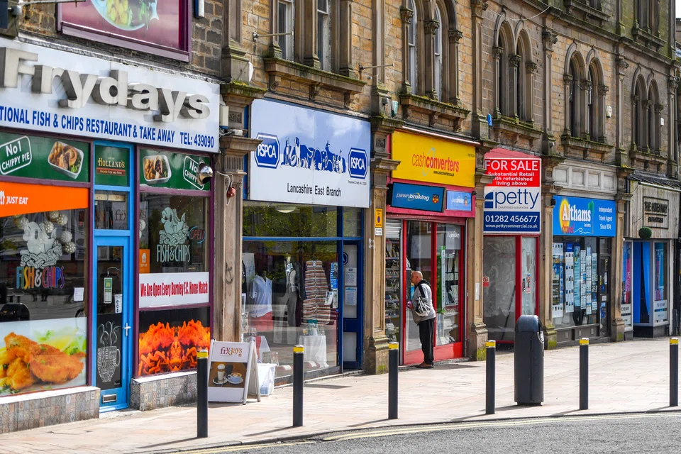 British shoppers, feeling the hit from surging inflation, cut their spending for the first time since early 2021. 