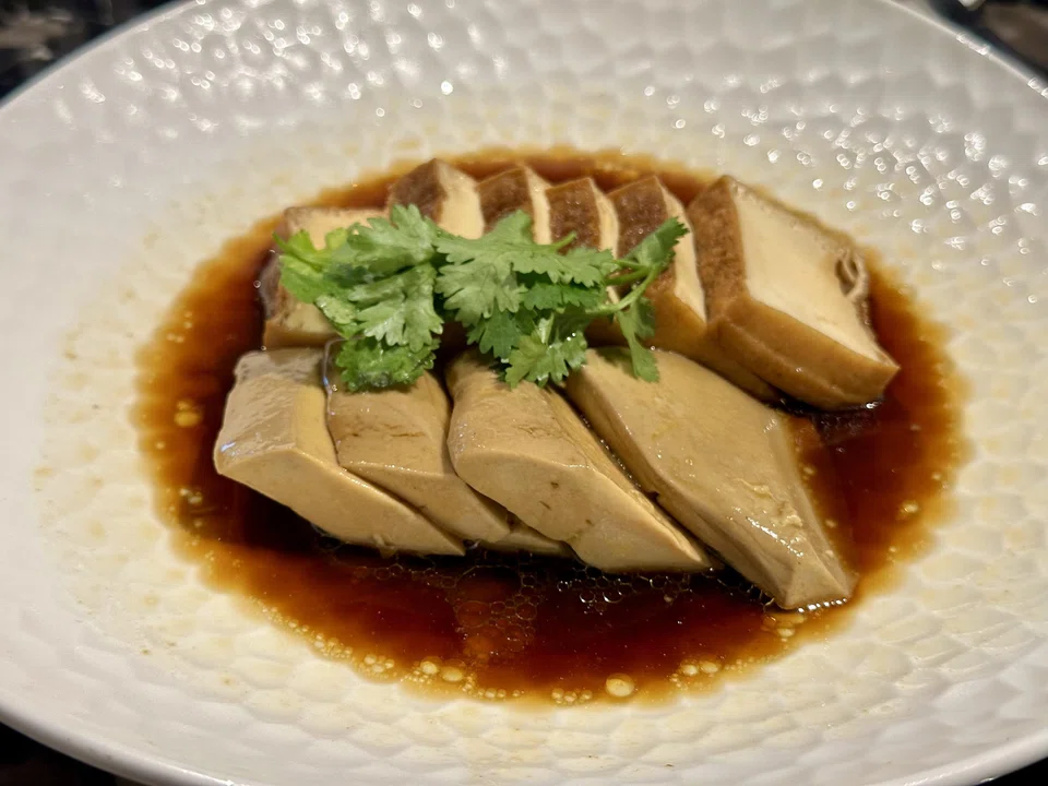 The off-menu special of braised foie gras in soy sauce gravy is a surprise hit.