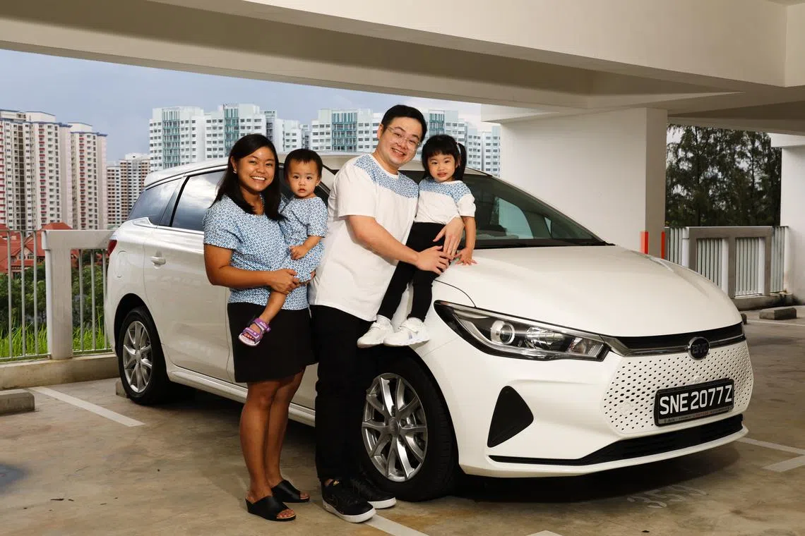 Eric Lim (second from right), who previously owned a Japanese car, bought an electric vehicle from a Chinese automaker after 3 visits to the showroom and 2 test drives.