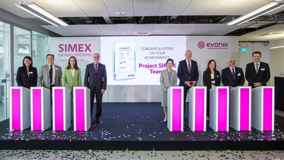 Minister for Sustainability and the Environment Grace Fu (fifth from left) along with Evonik's deputy chairman Harald Schwager (fourth from left) and other officials at the opening of the chemical giant's expanded facility on Jurong Island.