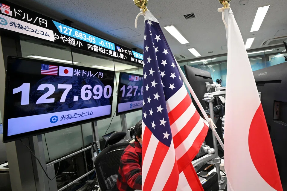Electronic boards display the Japanese yen's rate against the US dollar in Tokyo. 