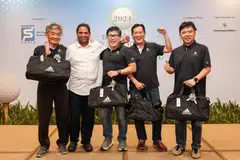 Singapore Pools players in black T-shirts (from left) Lee How Sheng, Tay Boon Khai, Francis Wan and Kevin Pang are all smiles after receiving their prizes from organising committee chairman S Murali (second from left) at Seletar Country Club.