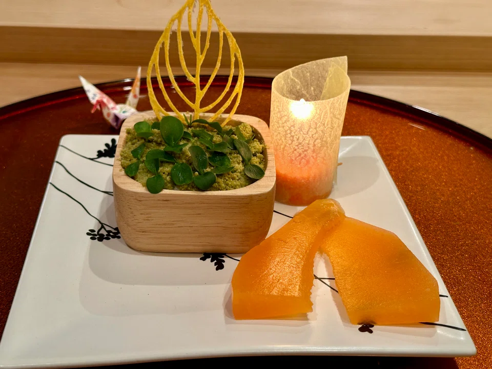 Pretty but odd dessert of soya pudding, matcha and leaves is served with compressed melon.