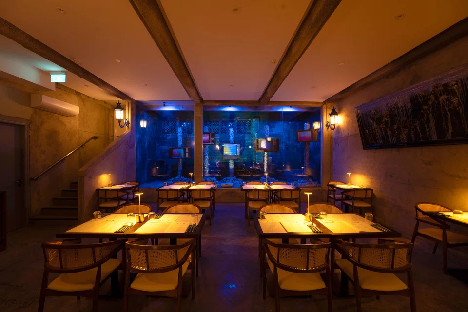 The neon-lit, retro TV art installation.