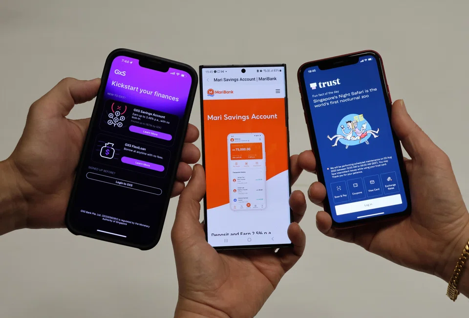 From left: Phone apps of GXS bank, Maribank and Trust Bank. Of the three digital banks, GXS and MariBank are a long way from meeting capital targets required to become full-fledged digital retail banks.