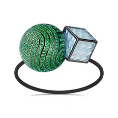 Boucheron's creative pieces include a hair-tie jewel in titanium with tsavorites, mother-of-pearl and lacquer.   