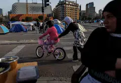 Children at a makeshift encampment on Apr 15 for people displaced following Israeli evacuation orders in Beirut. 