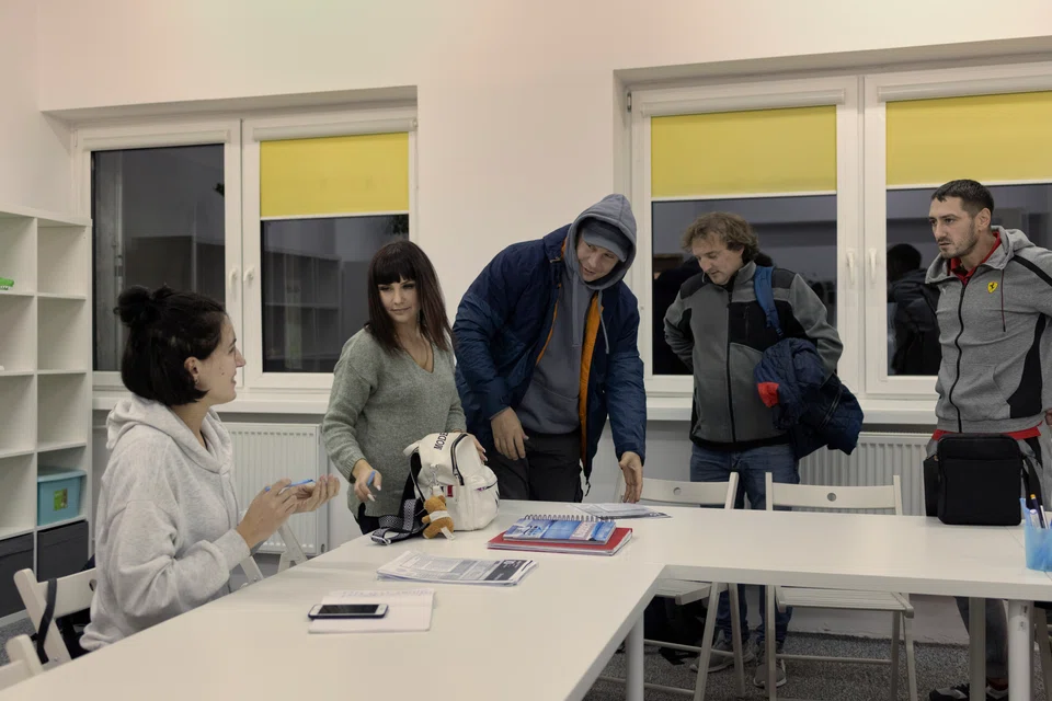 Ukrainian refugees at a Polish language class organised by the aid group We Support Ukraine Together in Lodz, Poland on Nov 8. Ukrainians fleeing war were also given access to free psychological support, food aid and health care.