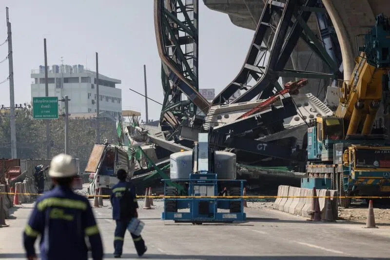At least two people were killed when a crane collapsed from an under-construction elevated expressway onto a road in Thailand’s Samut Sakhon province.