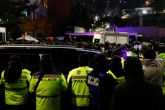 Police officers gather near the official residence of impeached South Korean President Yoon Suk Yeol, as authorities, including the Corruption Investigation Office for High-ranking Officials, seek to execute an arrest warrant, Seoul, South Korea, Jan 15, 2025. 