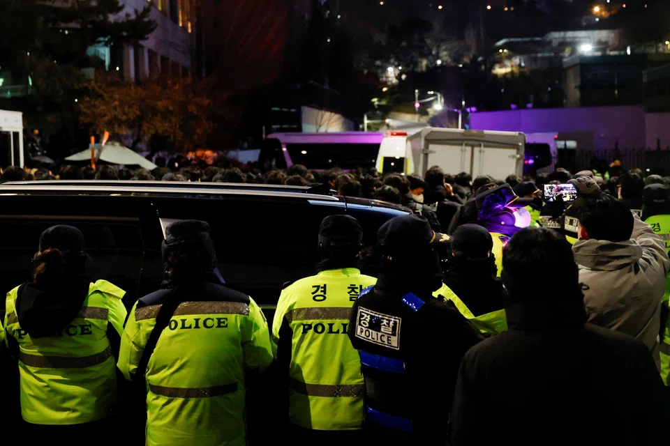 Police officers gather near the official residence of impeached South Korean President Yoon Suk Yeol, as authorities, including the Corruption Investigation Office for High-ranking Officials, seek to execute an arrest warrant, Seoul, South Korea, Jan 15, 2025. 