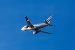 An Airbus SE A318-111 passenger aircraft, operated by Air France-KLM. The company said it was on track to fully pay back French state aid by April 2023, reporting a net debt of 6.3 billion euros, down 1.9 billion euros from the previous year.