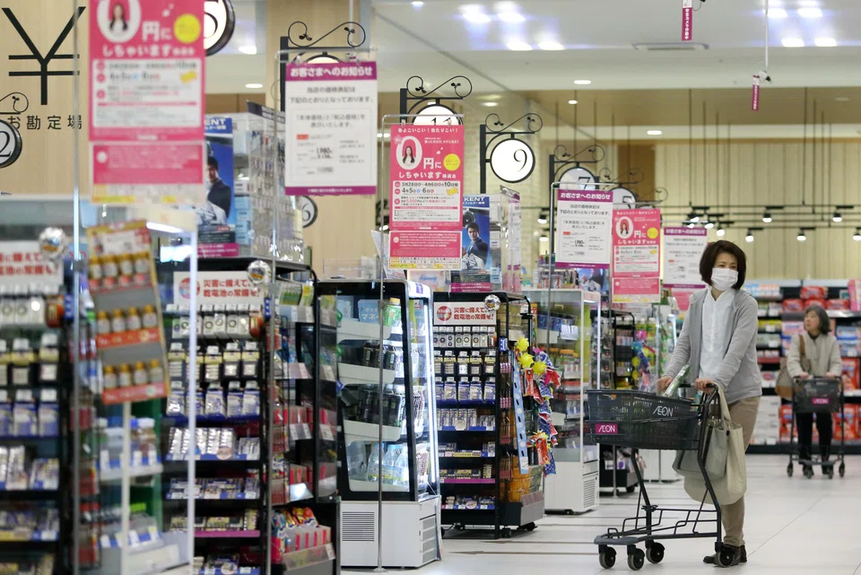Customers pushing shopping carts at an Aeon supermarket in Chiba, Japan. The supermarket is focusing on local foods and nurturing a sense of sustainability and community.