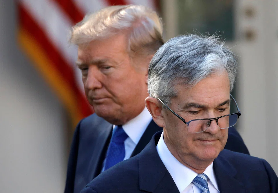 US President Donald Trump (left) has been pressuring Federal Reserve chair Jerome Powell for months to resume interest-rate cuts, in order to backstop the American economy while his disruptive tariff policy takes effect.