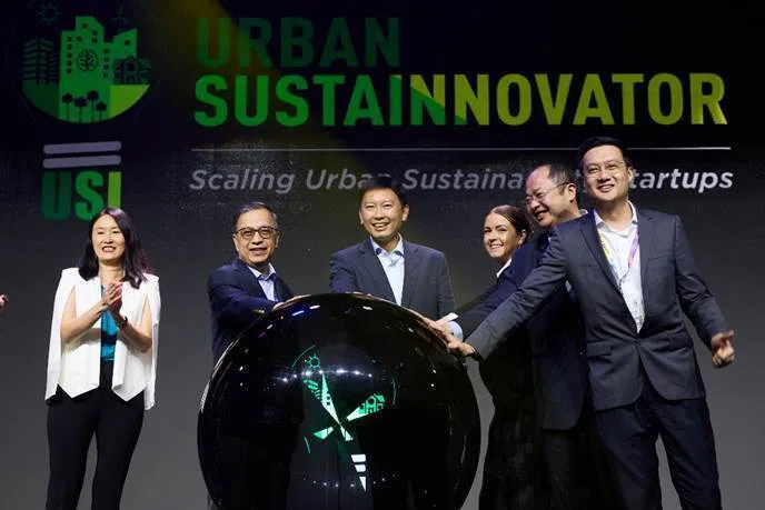 From left: Prof Lim Sun Sun, vice-president, partnerships and engagement, SMU; Prof Alan Chan, provost, SMU; Minister for National Development Chee Hong Tat; Beth Henderson, lead of startup programmes, The Gear by Kajima; Khoo Teng Lip, head, ST Engineering Ventures; and Jonathan Cheng, chief technology officer, Building and Construction Authority, at the launch of the Urban SustaInnovator programme.