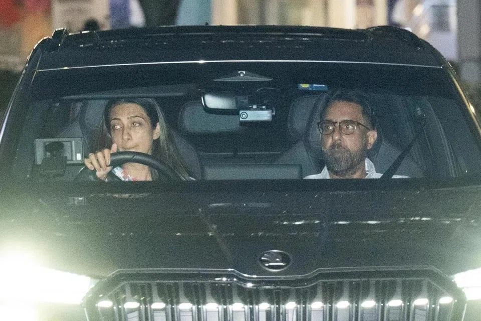 WP chief Pritam Singh and his wife leaving Parliament House on Jan 14.