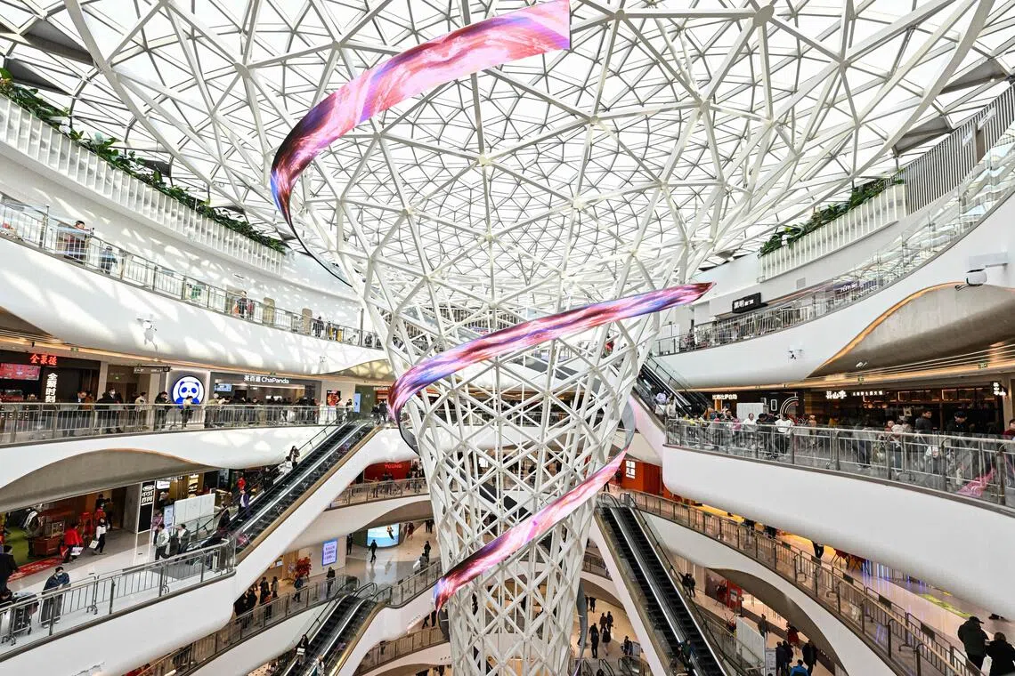 A shopping mall in Beijing. China will boost consumption and actively expand investment in new productive forces and people's overall development, says its finance ministry.