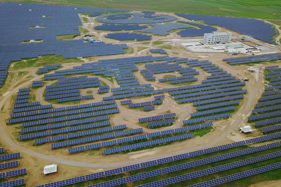 Solar panels are arranged to resemble pandas at a power plant in Datong. Even with a headlong renewables build-out, China's rising electricity consumption means that any shortfalls are met by coal generators.