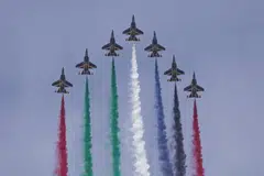 An aerobatic display team performs at the Dubai Airshow in Dubai, United Arab Emirates.