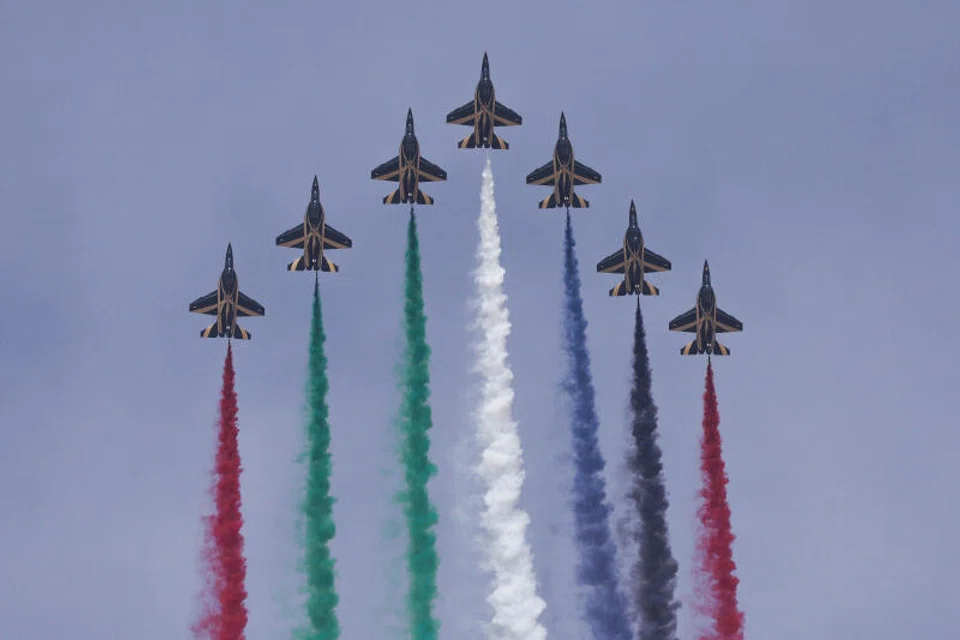 An aerobatic display team performs at the Dubai Airshow in Dubai, United Arab Emirates.