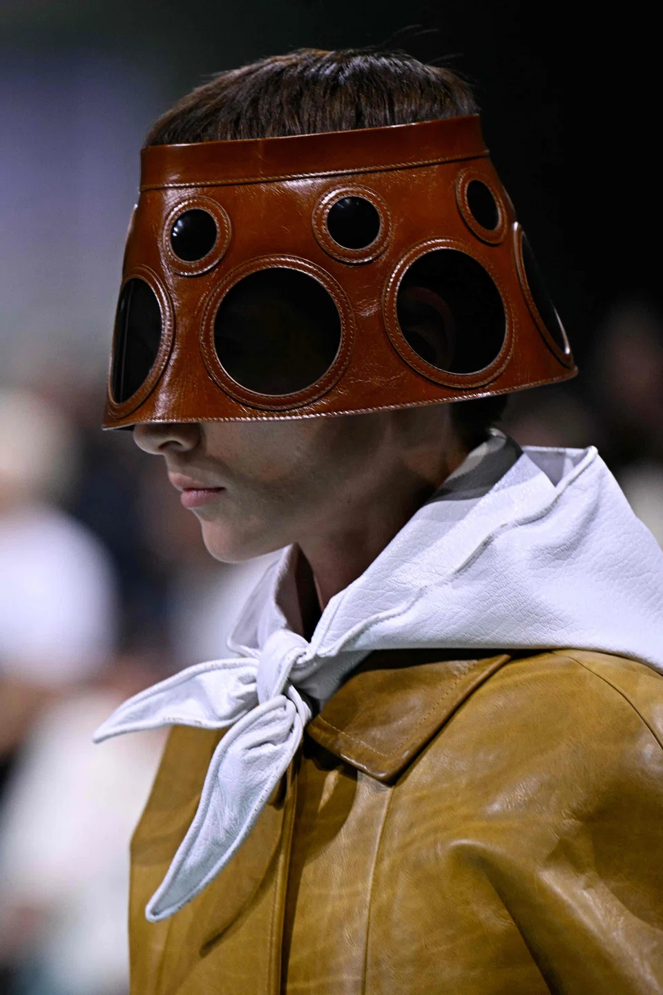 Accessories included huge sunglasses and topless goggle-like bucket hats (top) that covered faces.