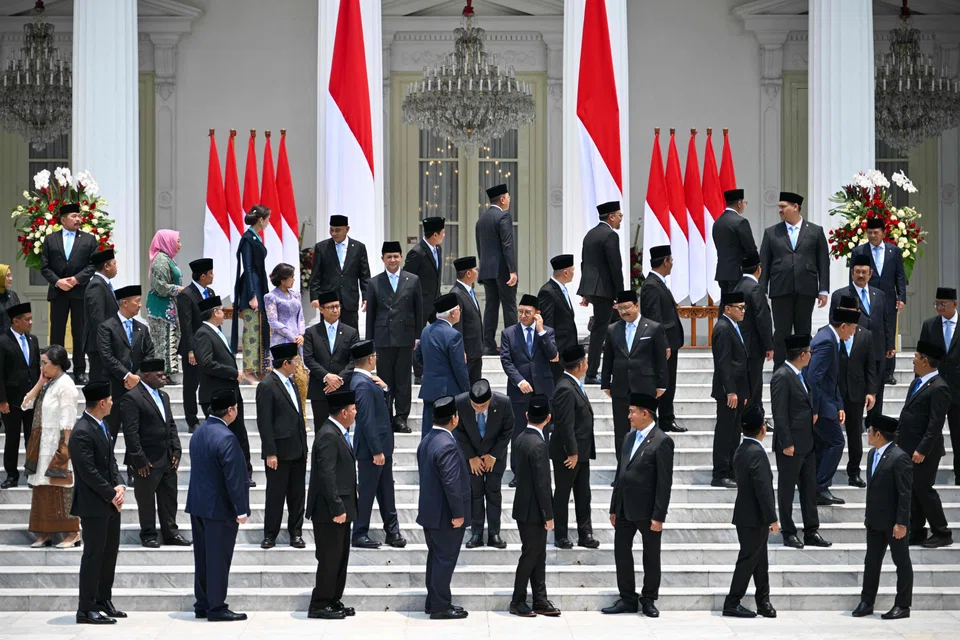 Indonesian ministers of Prabowo Subianto’s Cabinet gather for a group photo after their swearing-in ceremony in Jakarta.