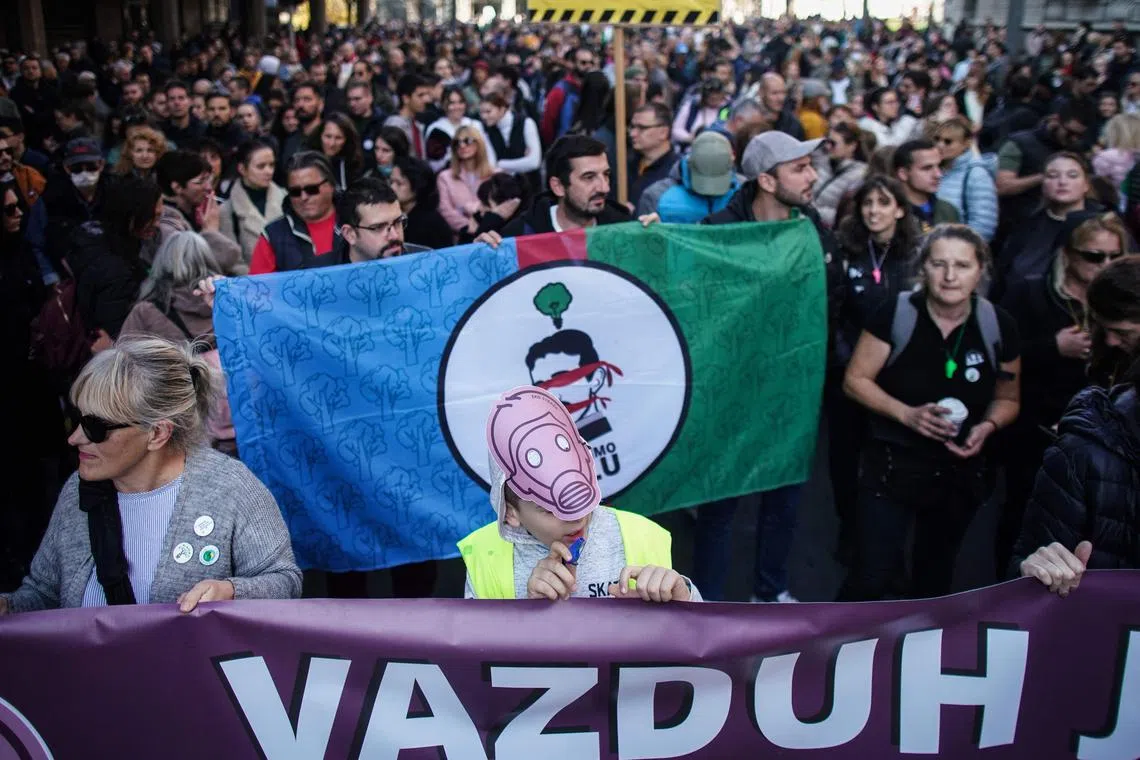 Demonstrators march during a "For our Children” protest against pollution in Belgrade, on Nov 13, 2022. Around the world, environmental issues affect billions of people, contributing to population displacement, social instability and conflict.