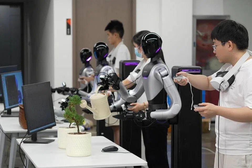 A human-controlled humanoid robot waters a potted plant at robotics start-up Zerith's data collection facility in Hefei.