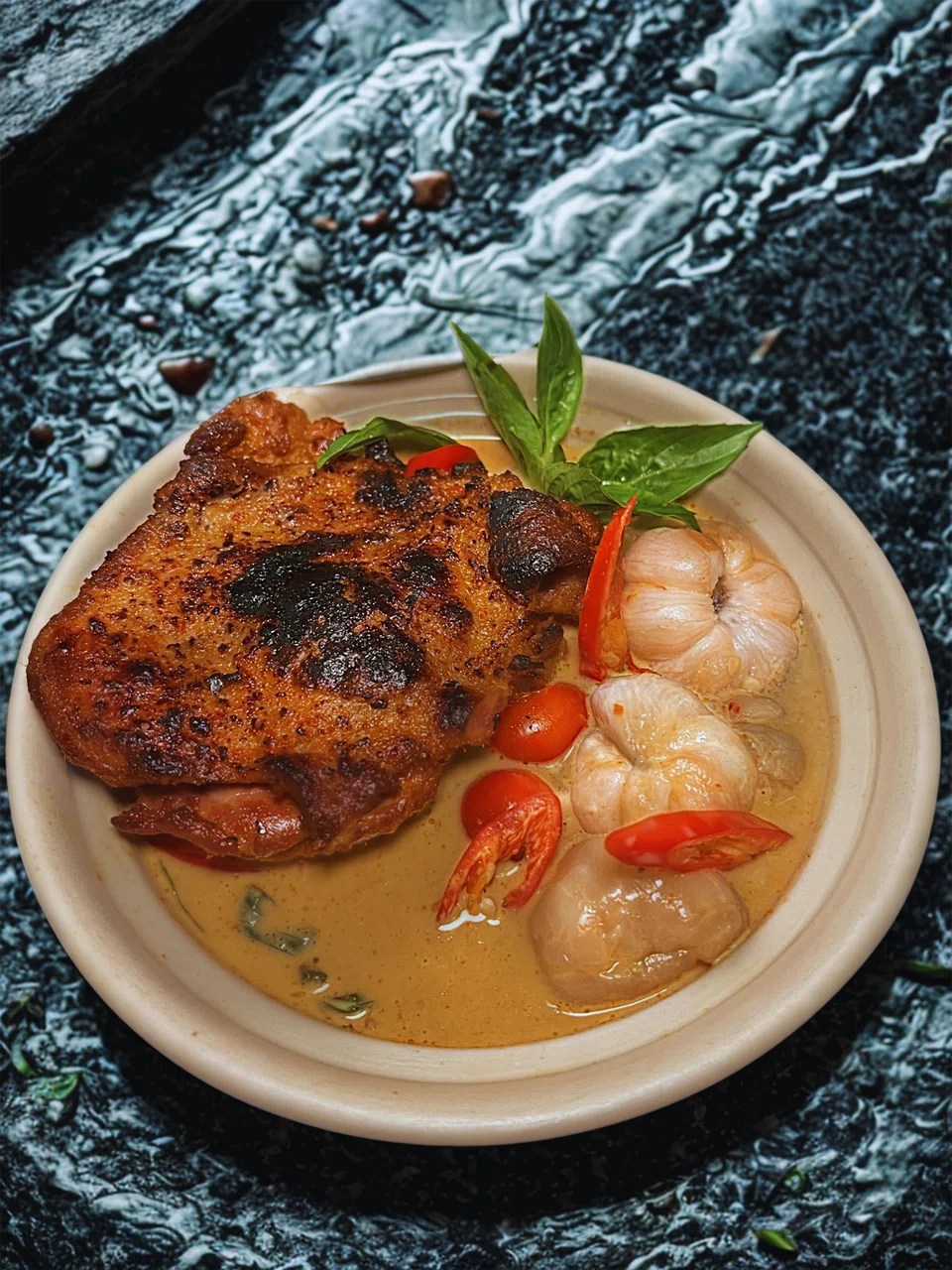 Spicy red curry with duck leg confit.