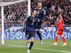 Japan's Daichi Kamada (left) celebrates his goal during the 2026 FIFA World Cup Asian qualification football match between Japan and Bahrain in Saitama, Japan, March 20, 2025. 