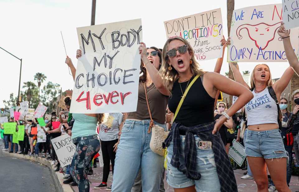A pro-choice rally in Tucson, Arizona on Jul 4. Earlier expectations that the Republicans would emerge as clear winners in the United States' Nov 8 midterm elections are being eroded, partly due to the Supreme Court's decision to put abortion rights in the hands of US state legislators.