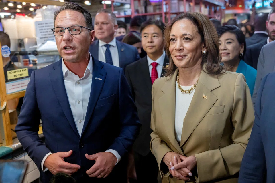 US Democratic Presidential nominee Kamala Harris and Pennsylvania Governor Josh Shapiro visit the Reading Terminal Market in Philadelphia, Pennsylvania, July 13, 2024. Harris is expected to announce her vice-presidential pic soon.