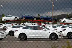 New electric vehicles at Tesla's primary vehicle factory in California. The EV maker said it intends to cut its use of rare earth materials.