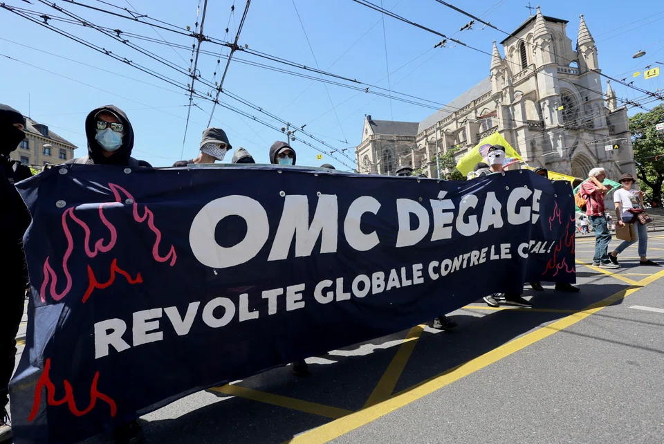 Anti-capitalist protests ahead of the World Trade Organization ministerial meeting in Geneva in June 2022. Neither the philosophy of degrowth nor libertarian belief in decentralised finance can solve the problems of capitalism.