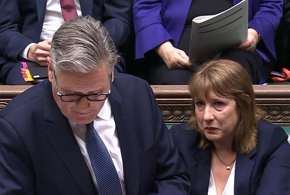 Britain's Chancellor of the Exchequer Rachel Reeves (right) appears tearful during the Prime Minister's Questions (PMQ) session in the House of Commons. London, Britain, July 2, 2025.
