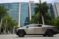 A Tesla Cybertruck passes the Wilkie D. Ferguson Jr. US Courthouse, Miami, Florida., July 14, 2025.