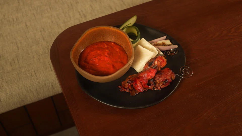 Satay merah jambu features grilled spiced mushrooms in peanut-free satay sauce.