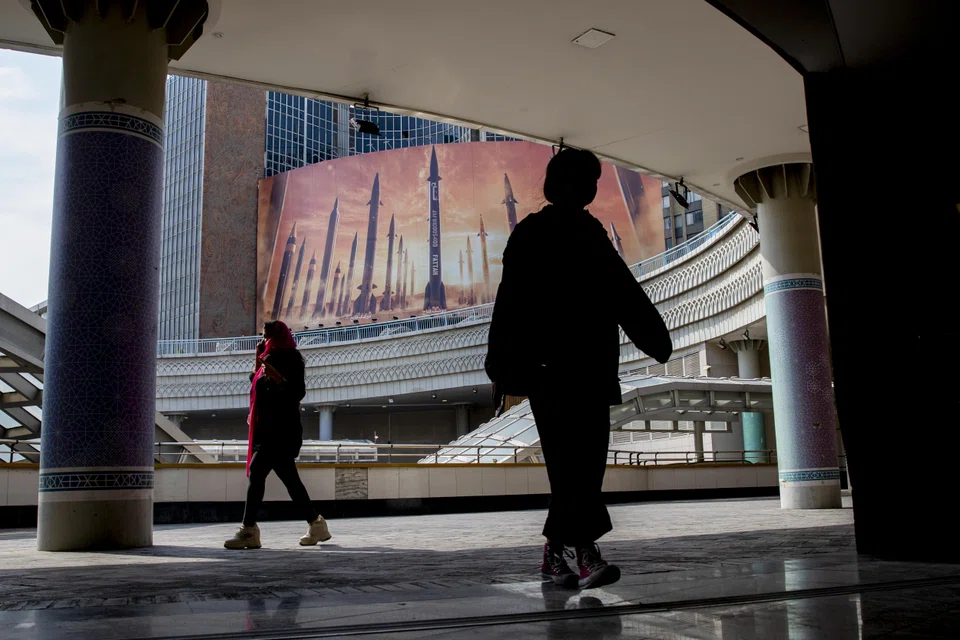 A billboard depicting missiles in a street in Teheran. Saudi Arabia has threatened to develop nuclear weapons if Iran does. If more states choose to become nuclear-armed, the probability of accidents and miscalculations would increase substantially.