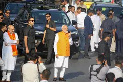 Indian Prime Minister Narendra Modi (centre) shows his ink-marked finger after casting his vote for the third phase of general elections in Ahmedabad, Gujarat, India, May 7, 2024. The Indian general elections are held in seven phases between April 19 and June 1, with the results announced on June 4, 2024.  