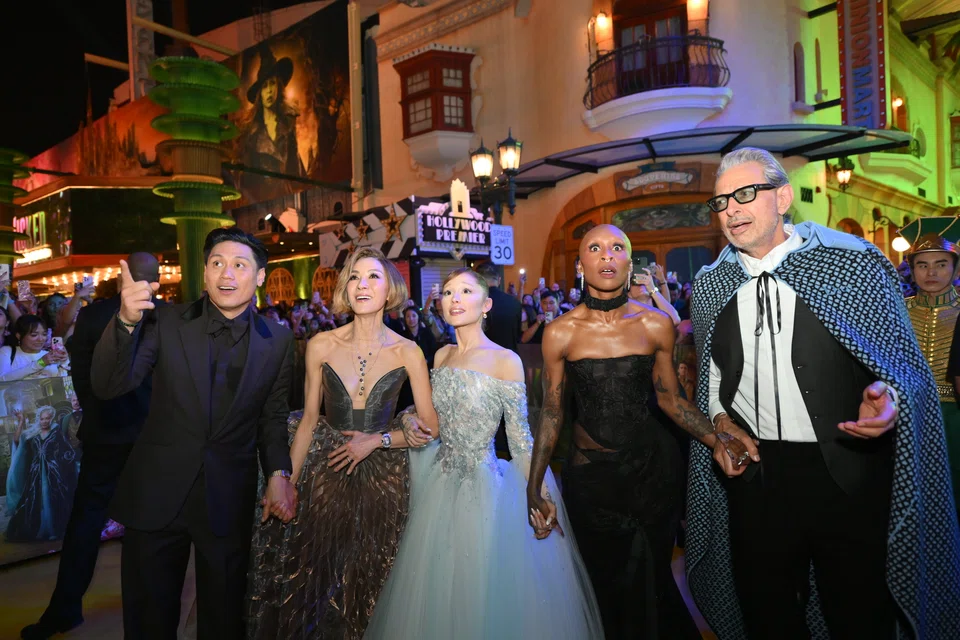 From left: Director Jon M Chu and cast members Michelle Yeoh, Ariana Grande-Butera, Cynthia Erivo and Jeff Goldblum on the yellow carpet at the film's Singapore premiere.