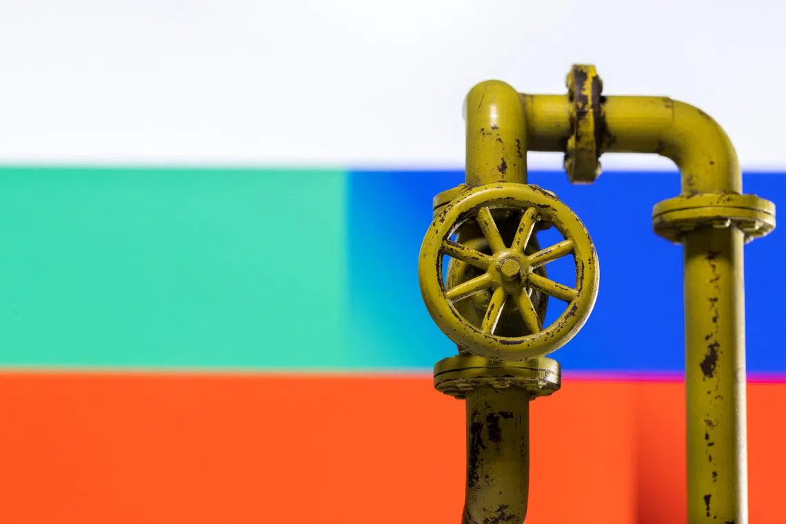 A model of the natural gas pipeline is seen in front of displayed Bulgarian and Russian flag colours in this illustration.