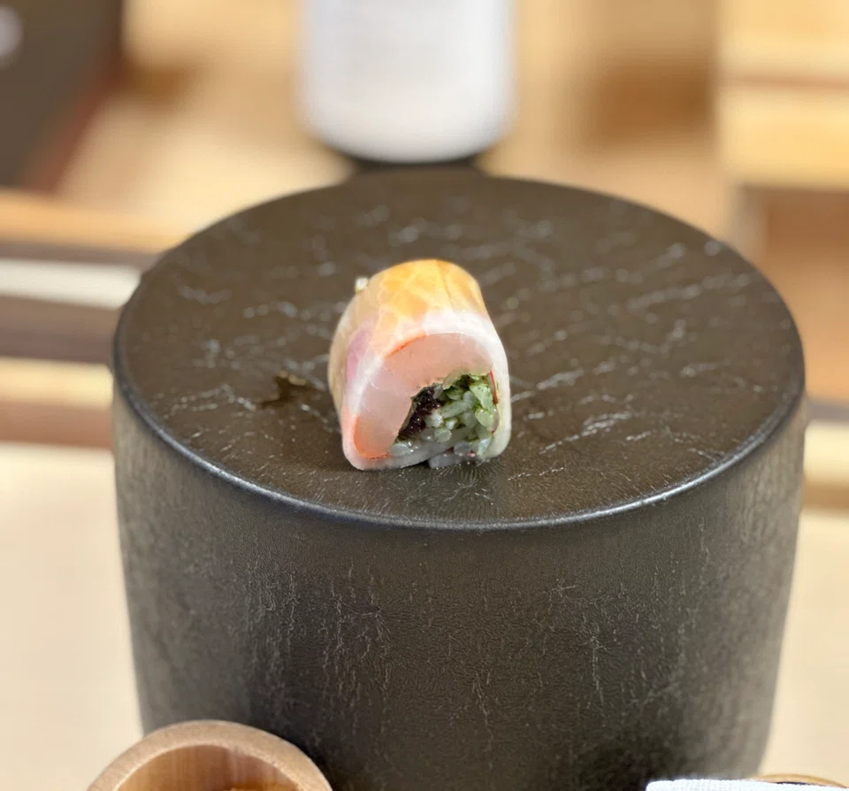 Gejo's hirame rolled in daikon with pickled vegetables.
