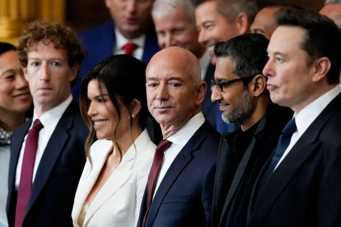 From left: Mark Zuckerberg, CEO of Meta Platforms; Lauren Sanchez, Jeff Bezos' fiancee; Jeff Bezos, founder of Amazon.com.; Sundar Pichai, CEO of Alphabet; and Elon Musk, CEO of Tesla, at the presidential inauguration in the US Capitol in Washington, DC, on Jan 20. 