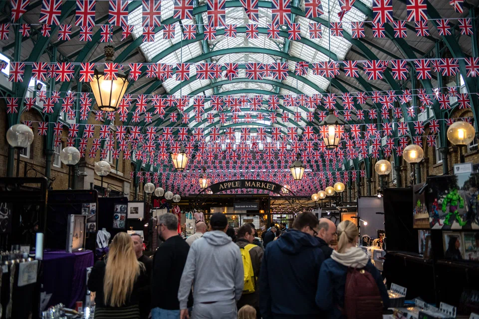 A shopping area in London's Covent Garden during Queen Elizabeth's Platinum Jubilee celebrations last June. British living standards have been hammered by a surge in inflation, which hit a 41-year high of 11.1 per cent in October.