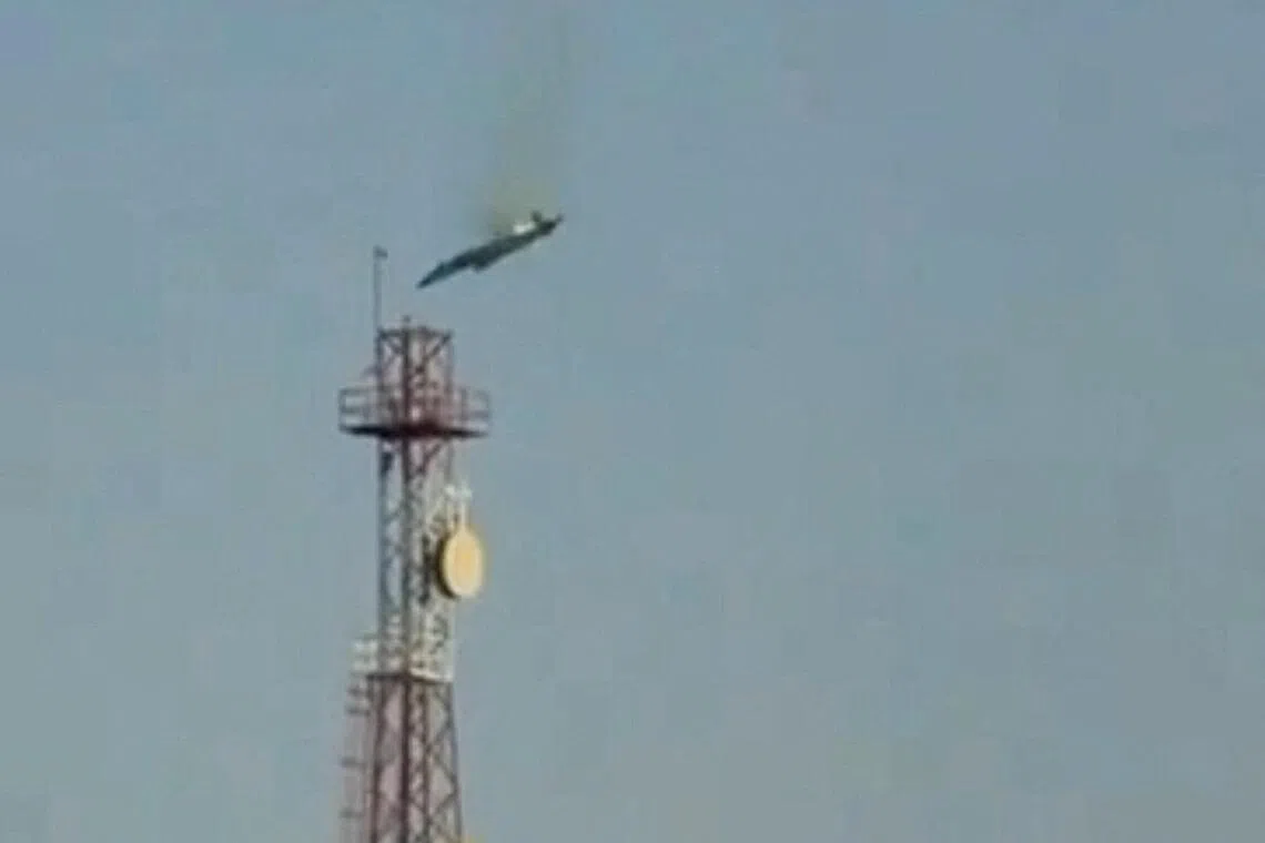 A burning aircraft falls from the sky in Al Jahra, Kuwait, in this still image obtained from a social media video on Mar 2.