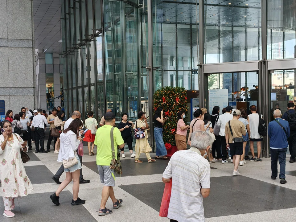 Crowds queue to buy gold outside UOB's main branch. The bank’s latest moves follow weeks of heightened interest in precious metals.