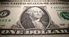 The dollar index, which measures the US currency against six others, slipped as much as 0.55 per cent to near one-month lows of 103.67 after Goldman Sachs said it no longer expects the Fed to deliver a rate hike at its March 22 meeting.