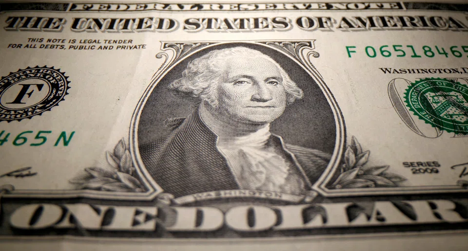 The dollar index, which measures the US currency against six others, slipped as much as 0.55 per cent to near one-month lows of 103.67 after Goldman Sachs said it no longer expects the Fed to deliver a rate hike at its March 22 meeting.