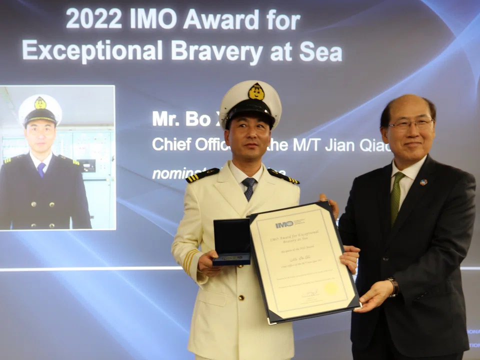 Chief officer Xu Bo (left) was awarded the 2022 IMO Award for Exceptional Bravery, at the International Maritime Organization headquarters in London.